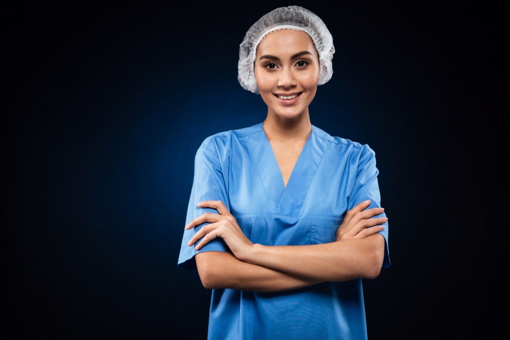 cheerful female doctor looking smiling isolated