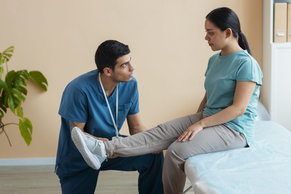 doctor helping patient rehabilitation