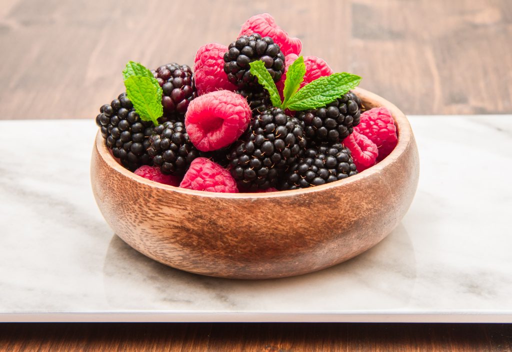 wooden cup with fresh berries 1